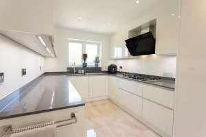 White Kitchen and Black Countertop